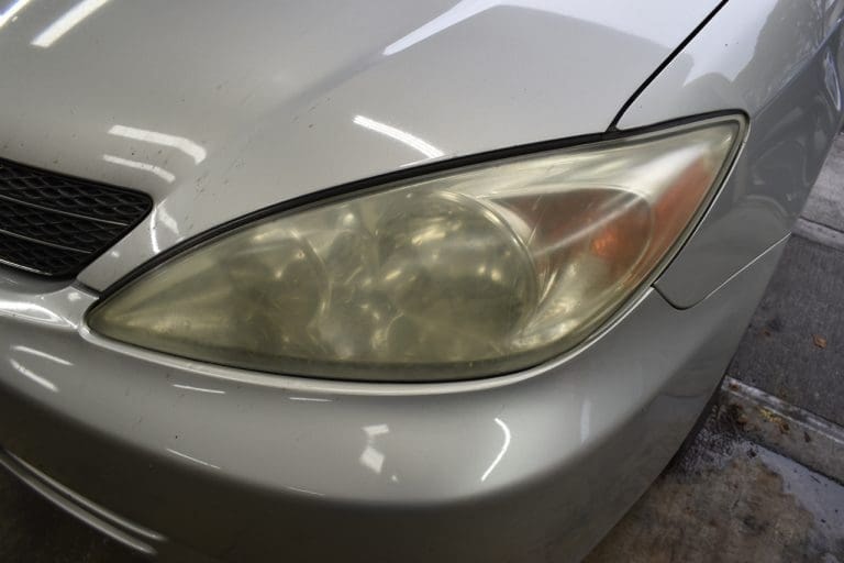 Oxidized yellowed headlight before restoration