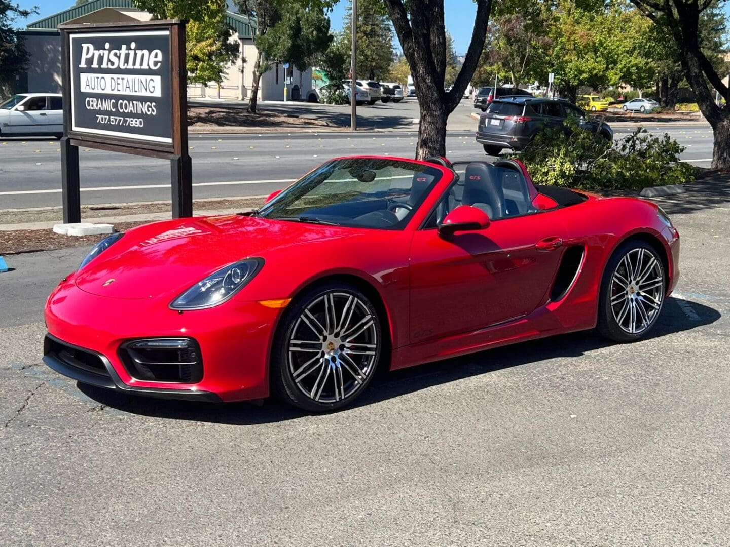 Red convertible Porsche after ceramic coating application