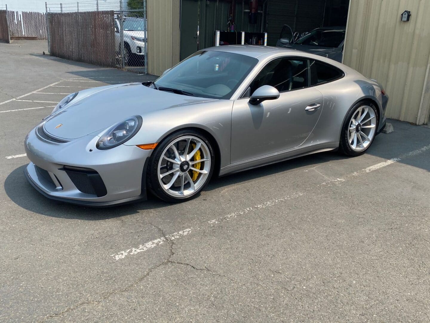 Silver Porsche GT3 touring after ceramic coating application